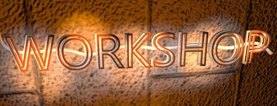 Ordet "Workshop" skrevet med lysende bogstaver på en brungul væg.